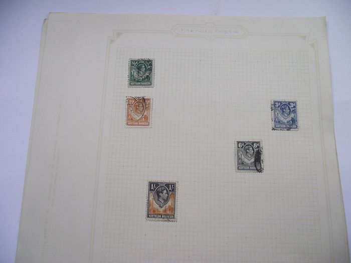 A collection of stamps from Northern Rhodesia, Southern Rhodesia, Rhodesia, South Africa and Nyasaland on loose pages