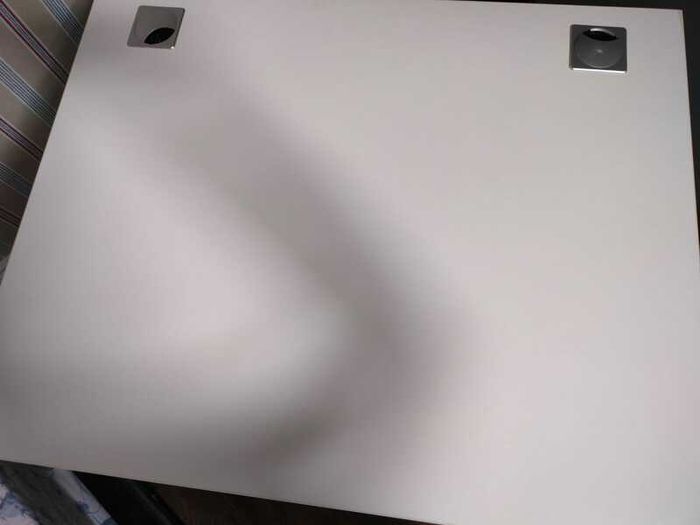 Modern white office desk with grey metal frame