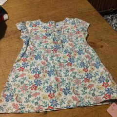 Young Dimension floral print baby dress with a small bow detail at the neckline. New with tags.