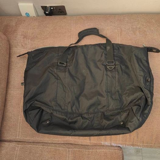 Large black expandable travel bag with shoulder strap