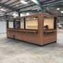 A 6-meter (20-foot) shipping container housing a cafe, with a very minimalist design Image 3