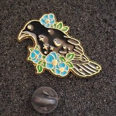 Raven and rose, pin back badge.