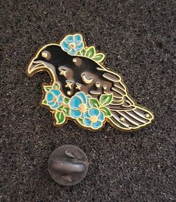 Raven and rose, pin back badge.