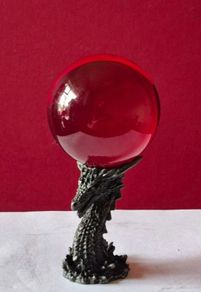 Red crystal/glass ball and metal dragon stand.