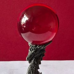 Red crystal/glass ball and metal dragon stand.