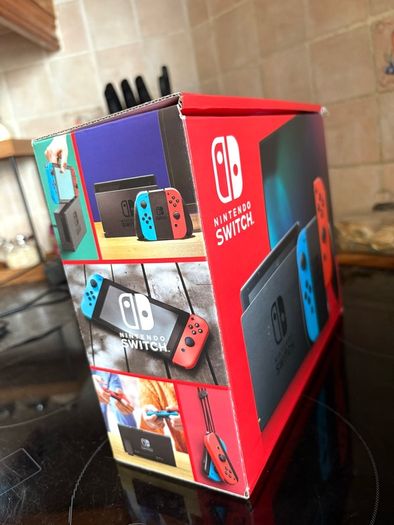 Nintendo Switch Neon Red/Blue with Improved Battery Life- Barely used