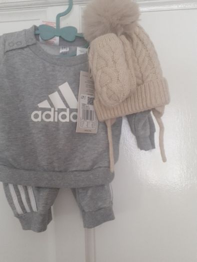 New baby boy bundle with tags .Consists of Addidas tracksuit . Name it top .Hat and gloves .pack of 7 pair socks .2 pair of rattle socks and free sunhat new  and green cable jumper all new  17 euro the lot