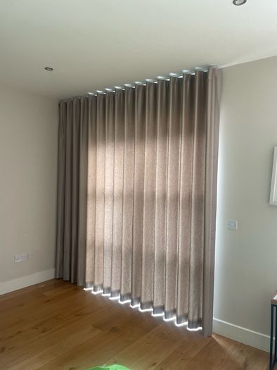 Wave fold curtain and slim line ceiling track