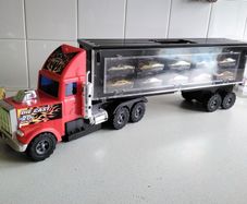 Model large plastic model truck with car trailer and ten cars on one side