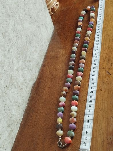 Necklace of multicolored artificial stones.