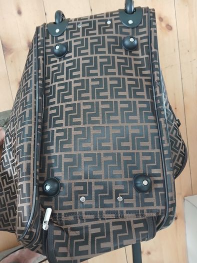 Brown carrier bag on wheels