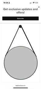 black round mirror with strap