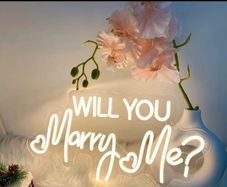 neon sign 'will you marry me?'