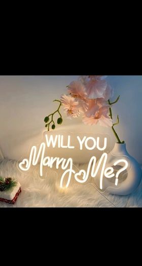 neon sign 'will you marry me?'