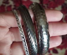 Beautiful bracelets in silver tone.