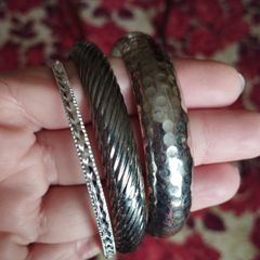 Beautiful bracelets in silver tone.