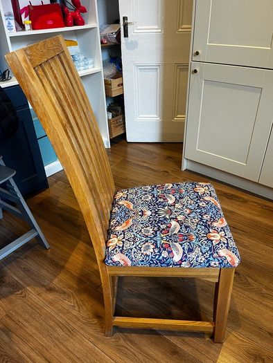 Solid oak dining table & 6 reupholstered dining chairs