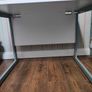 Modern white office desk with grey metal frame Image 3