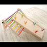 Wee Un Sawdust and Rainbows pikler triangle slide and ring toss Image 2
