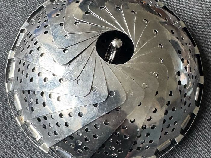 This is a collapsible stainless steel steamer basket