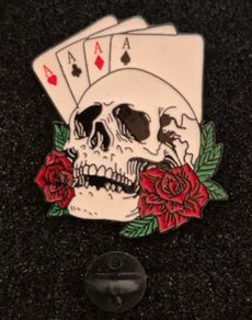 Skull and ace's ,  pin back badge.