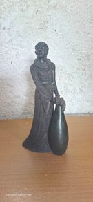striking lady-in-gown sculpture with a built-in bud vase