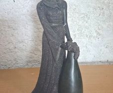 striking lady-in-gown sculpture with a built-in bud vase