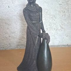 striking lady-in-gown sculpture with a built-in bud vase