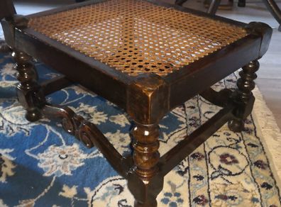 Antique solid wood foot rest with cane top