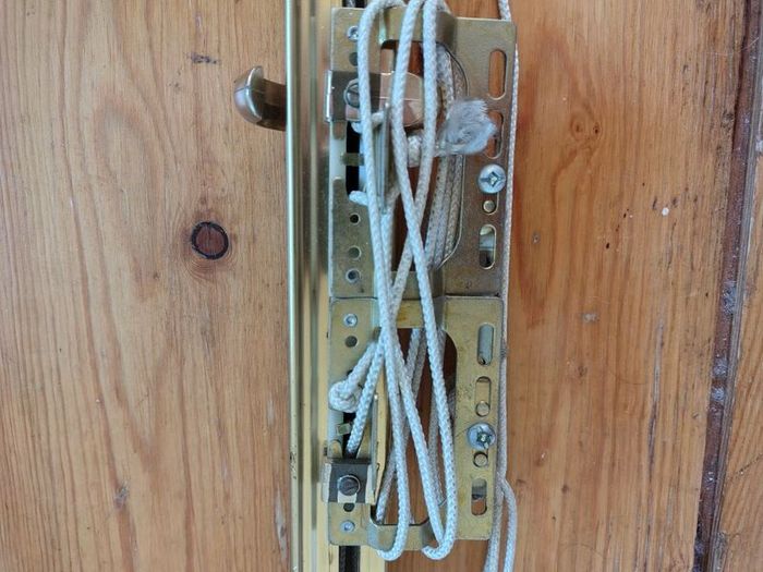 Brass coloured curtain track