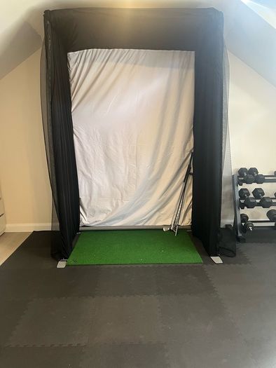 Golf simulator enclosure and impact screen