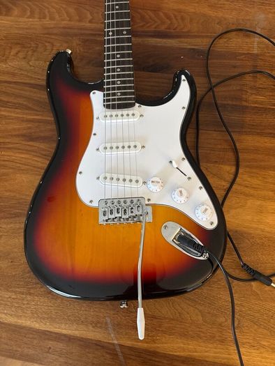 Electric guitar with amplifier