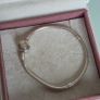Pandora two-tone signature braceletsterling silver snake chain and a 14K gold logo clasp, size 18cm Image 3