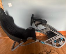 Logitech G edition sim seat with PlayStation wheel, pressure sensitive pedals and gear stick