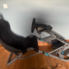 Logitech G edition sim seat with PlayStation wheel, pressure sensitive pedals and gear stick