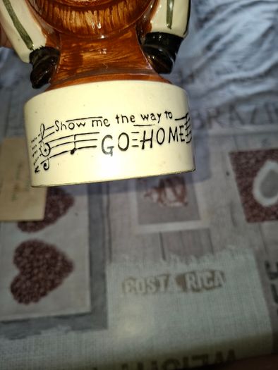 1950s to 70s Working Musical Decanter Hobo Clown Sitting on a Barrel. The base plays the tune Show Me the Way to Go Home, reminded me of the song from Jaws