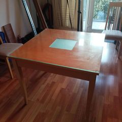 Square glass topped dining table