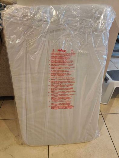mattress - brand new chicco next to me
