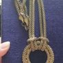 Vintage necklace with a pendant in the form of a ring and links in the form of a snake in gold tone. Image 4