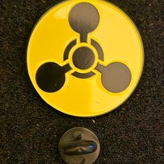 Chemical weapons warning symbol, pin back badge.
