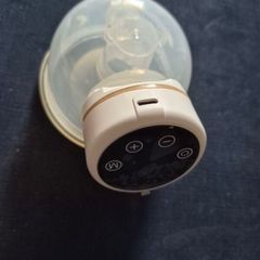 Wearable, portable breast pump