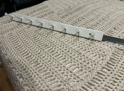 Sliding wardrobe hooks