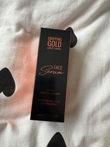Dripping gold face serum - tinted tanning drops
