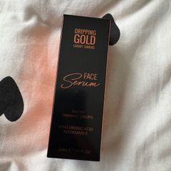Dripping gold face serum - tinted tanning drops