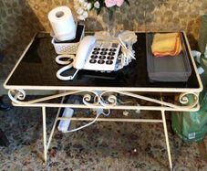 Black glass topped metal side table