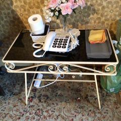 Black glass topped metal side table