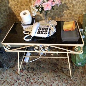 Black glass topped metal side table