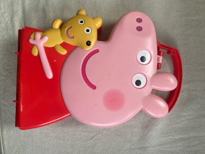 Peppa pig characters and suitcase