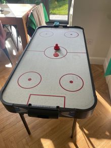 Air hockey table with accessories