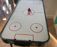 Air hockey table with accessories
